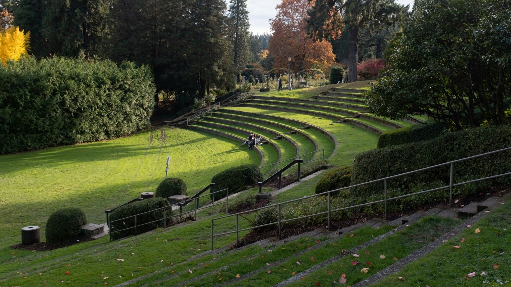 Outdoor amphitheater with green grass.
